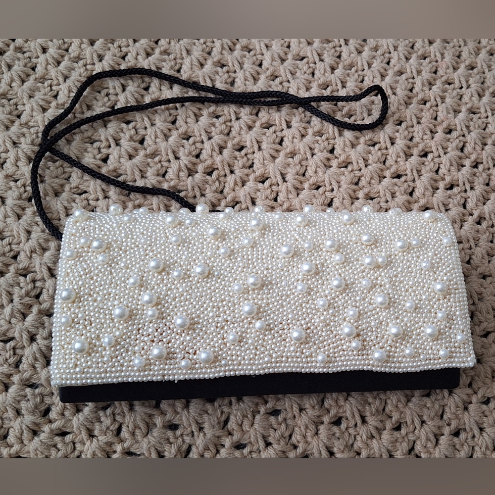 Elegant Pearl-Embellished Clutch. pearl color. Used Excelent Condition